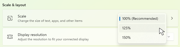 Windows 11 Display settings with the Scale dropdown open, showing 100%, 125%, and 150%.